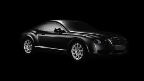 黑色表面上的黑色双门轿跑车 · 免费素材图片