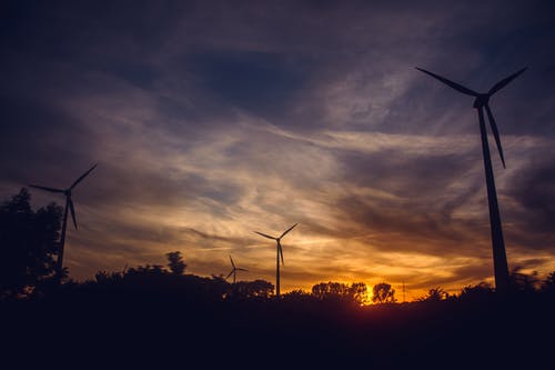 日落期间的黑色风车 · 免费素材图片