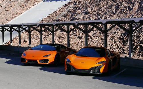 两个橙色跑车的摄影 · 免费素材图片