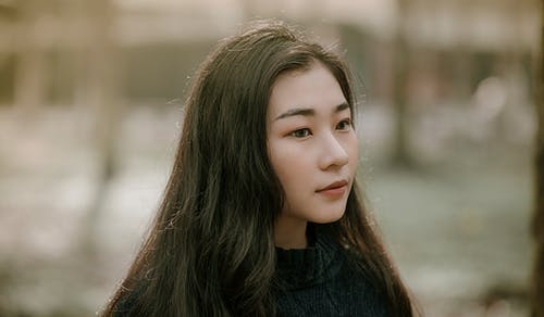 亚洲女孩的特写摄影 · 免费素材图片