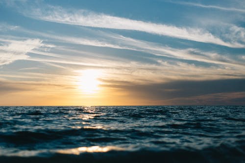 日落期间的海洋 · 免费素材图片
