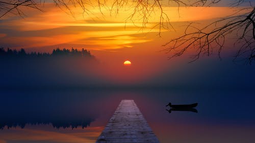 日落期间的棕色码头 · 免费素材图片
