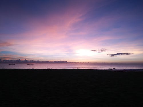 日落期间的海滨照片 · 免费素材图片