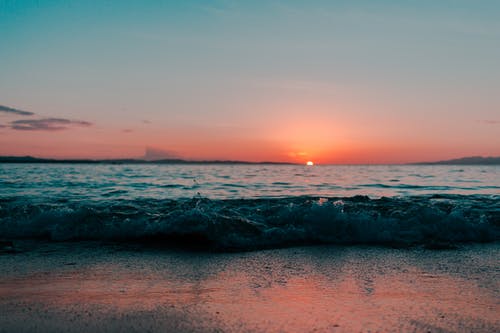 日落期间的海洋风景 · 免费素材图片