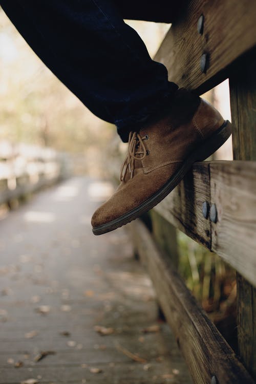 棕色靴子的选择性聚焦照片 · 免费素材图片