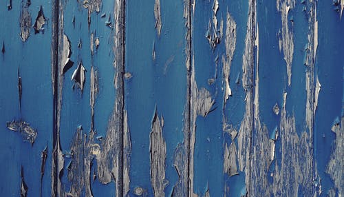 灰色墙体开裂的蓝色油漆 · 免费素材图片