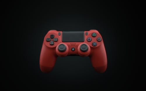 红色和黑色索尼ps4 Dualshock4的照片 · 免费素材图片