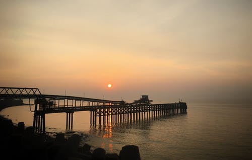 日落时码头的照片 · 免费素材图片