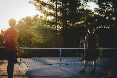 三名男子打网球的照片 · 免费素材图片