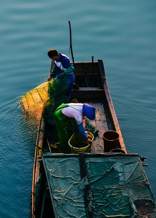 渔夫在船上的照片 · 免费素材图片
