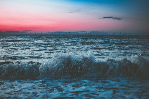黎明期间海滩的风景照片 · 免费素材图片