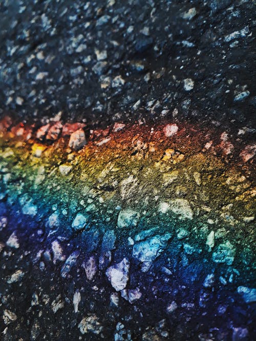 在粗糙的冰冷表面上的彩虹颜色的抽象背景 · 免费素材图片
