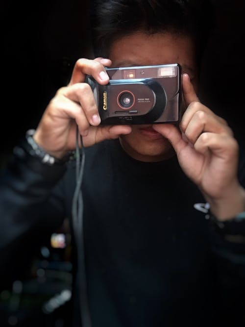 有关佳能, 垂直拍摄, 手的免费素材图片