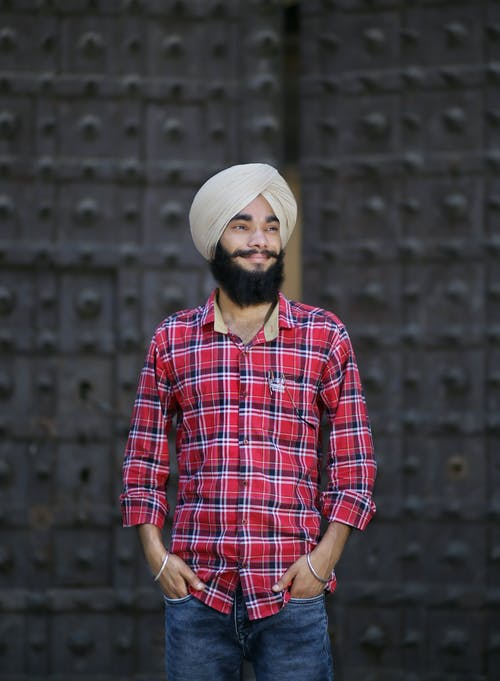 有关人, 双手插在口袋里, 垂直拍摄的免费素材图片