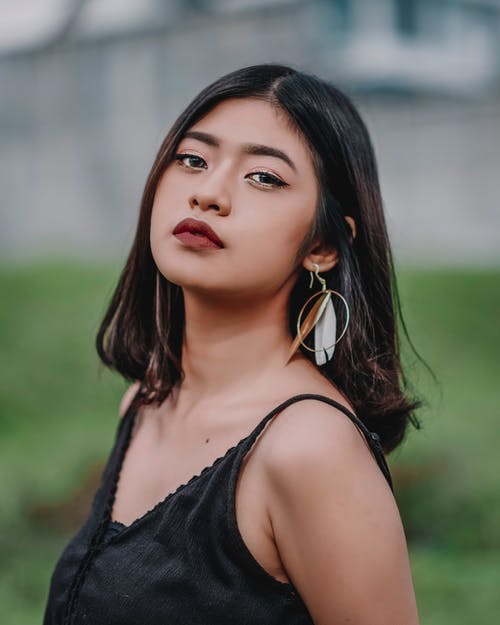 有关优雅, 咖啡色头发的女人, 垂直拍摄的免费素材图片