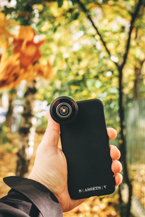 有关3C用品, 垂直拍摄, 手的免费素材图片