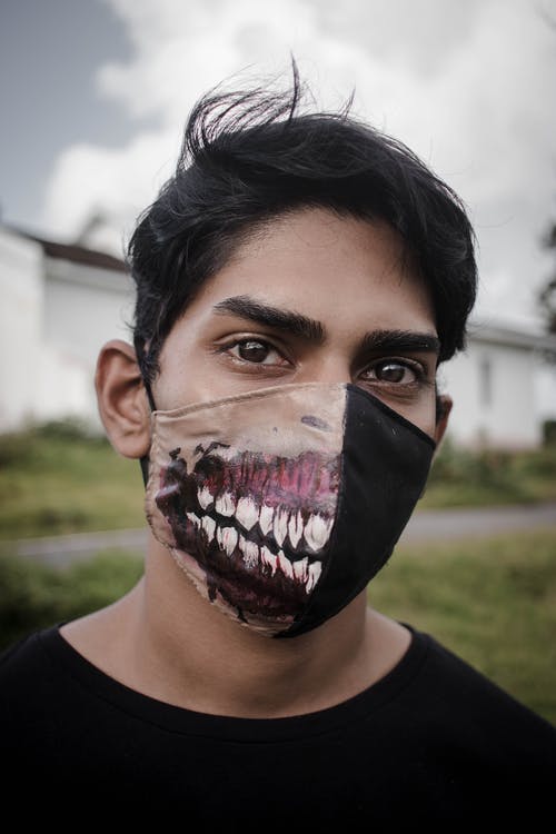 有关个人保护设备, 人, 垂直拍摄的免费素材图片