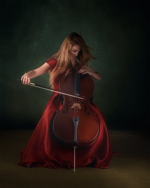 有关大提琴, 女人, 小提琴的免费素材图片