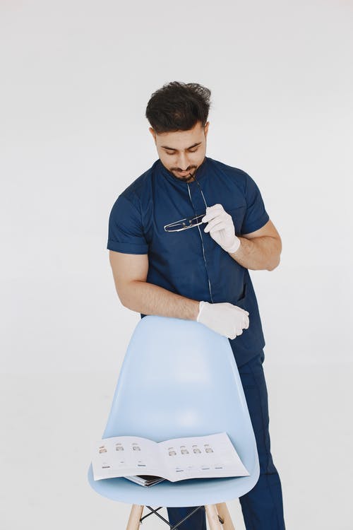 有关人, 医用手套, 垂直拍摄的免费素材图片