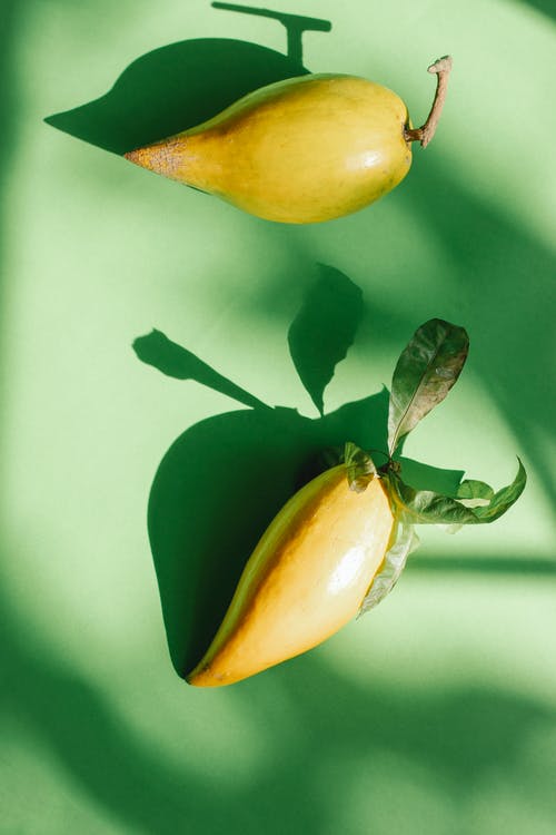 黄色和绿色的椭圆形水果 · 免费素材图片