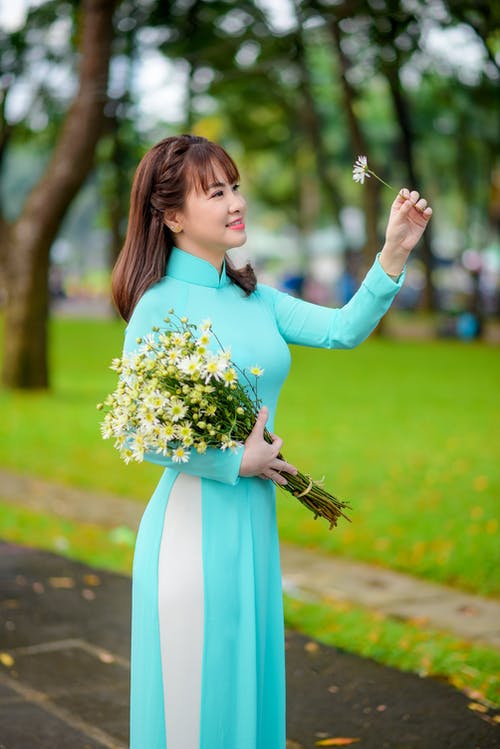 有关传统服装, 垂直拍摄, 奥黛的免费素材图片