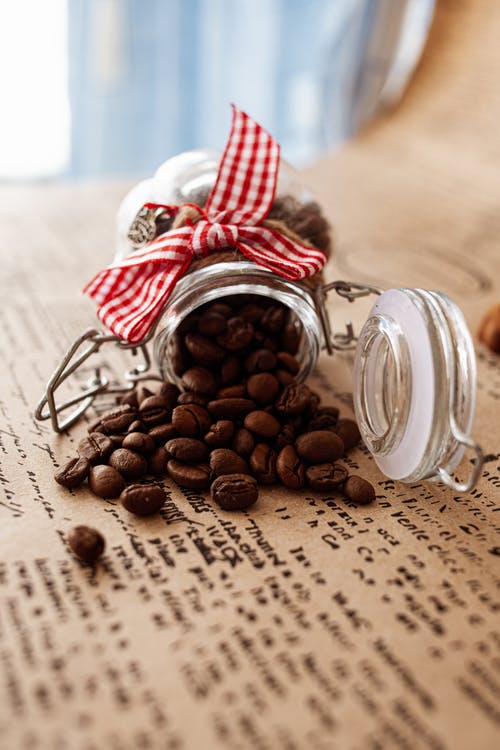 有关咖啡豆, 垂直拍摄, 牛皮纸的免费素材图片