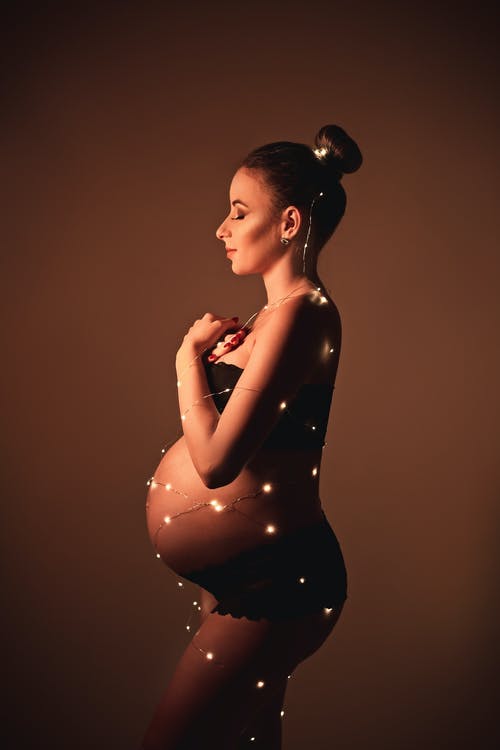 有关产假拍摄, 侧面轮廓, 垂直拍摄的免费素材图片