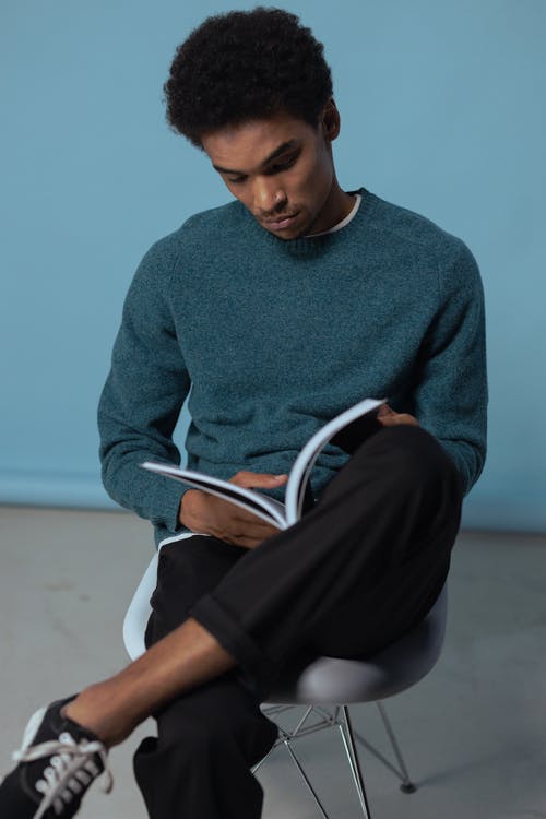 有关人, 坐, 垂直拍摄的免费素材图片