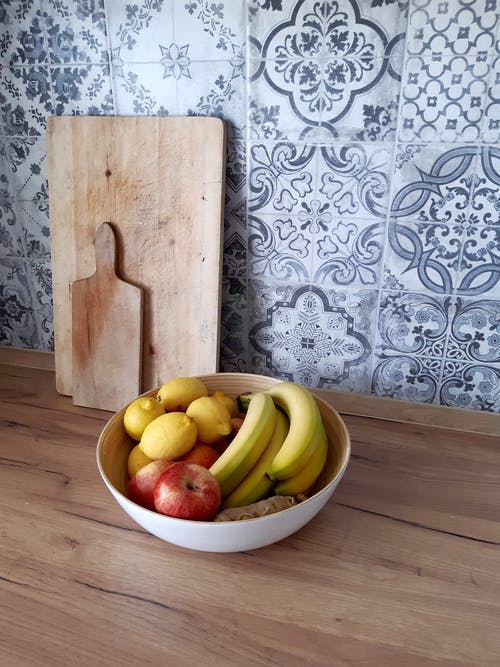 有关一碗水果, 切菜板, 垂直拍摄的免费素材图片