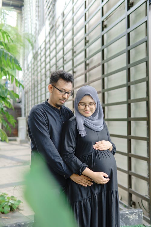 有关一对, 垂直拍摄, 怀孕的女人的免费素材图片