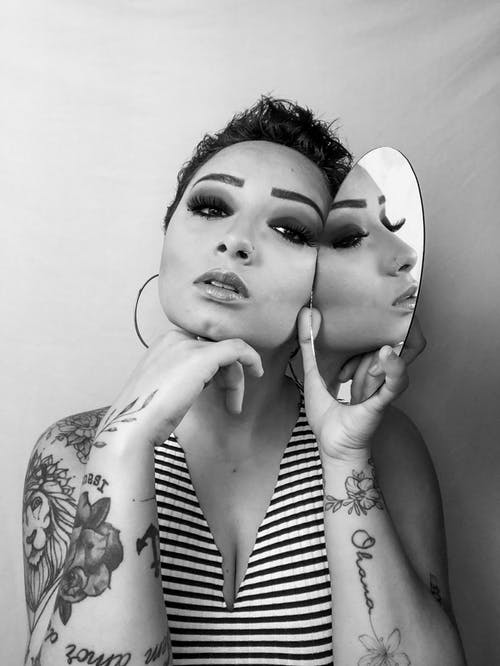 有关刺青, 反射, 垂直拍摄的免费素材图片