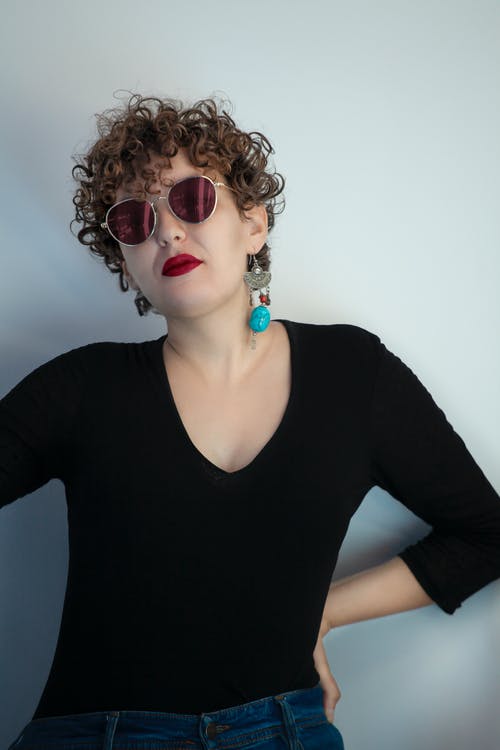 有关垂直拍摄, 墨镜, 女人的免费素材图片