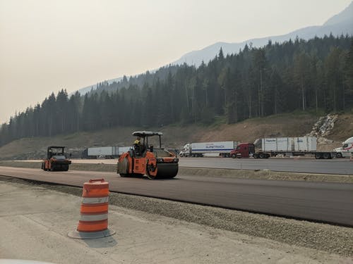 有关修路, 压路机, 工地的免费素材图片