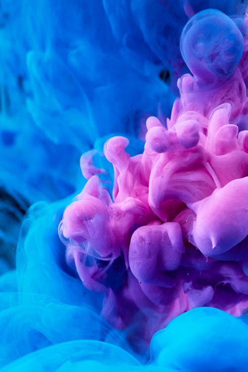 彩色墨水在水中扩散的高速摄影 · 免费素材图片