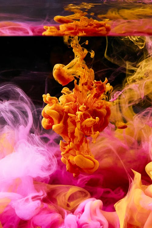 彩色墨水在水中扩散的高速摄影 · 免费素材图片