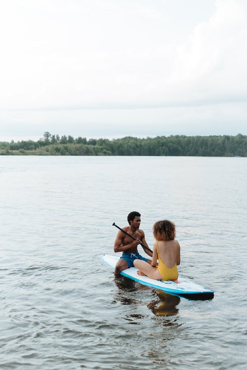 有关paddleboarding, 一对, 一起的免费素材图片