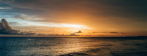 日落时海水的景色 · 免费素材图片