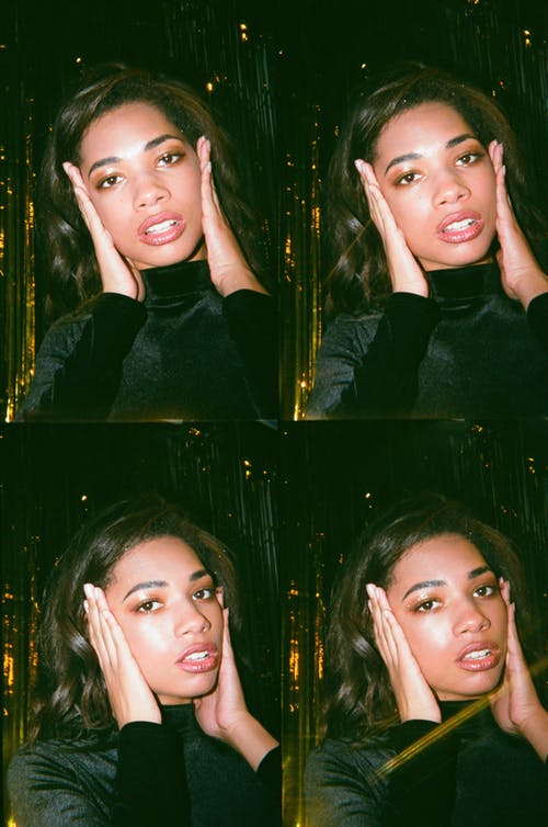 女人用两只手在脸颊上 · 免费素材图片