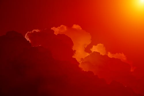 白天，橙色的天空下的白云 · 免费素材图片