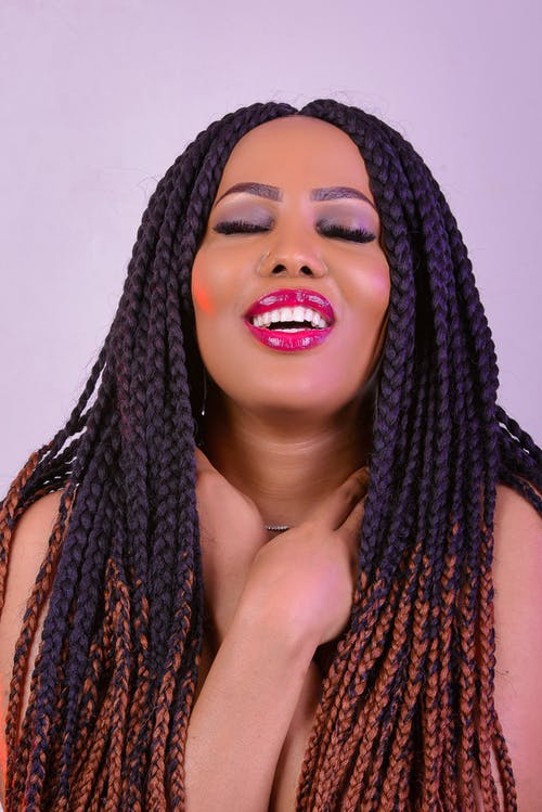 微笑的女人的特写摄影 · 免费素材图片