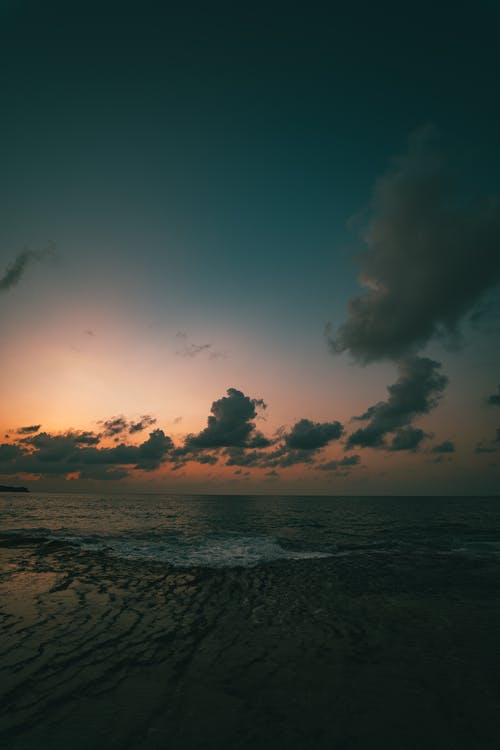在岸上的日落 · 免费素材图片