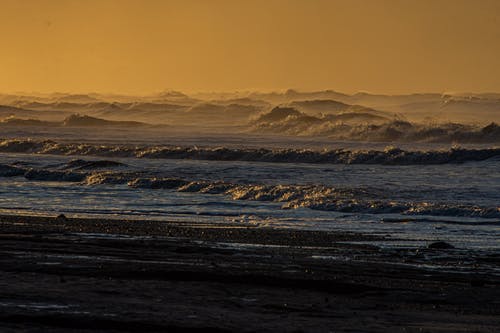 有关日落, 水, 波浪崩溃的免费素材图片