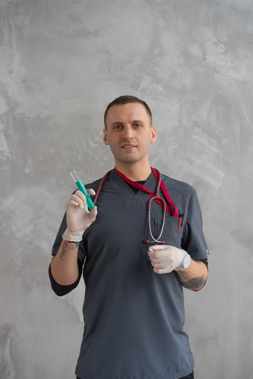 有关人, 医护人员, 垂直拍摄的免费素材图片