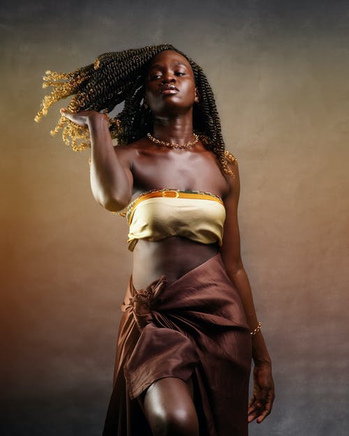 有关dreadlock, 垂直拍摄, 棕色背景的免费素材图片