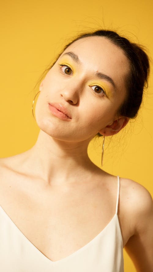 有关化妝, 垂直拍摄, 头部倾斜的免费素材图片