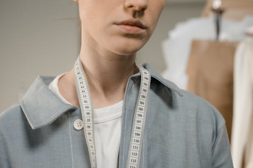 有关半张脸, 女人, 捲尺的免费素材图片