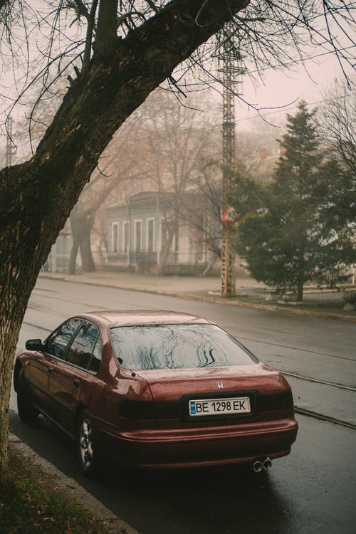 有关停, 四門轎車, 垂直拍摄的免费素材图片