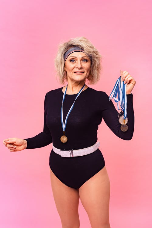 有关奖牌, 女人, 成人的免费素材图片