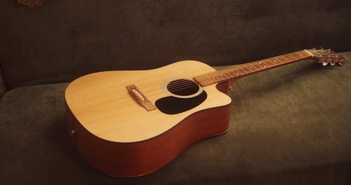 有关原声吉他, 弦乐器, 慢动作的免费素材视频