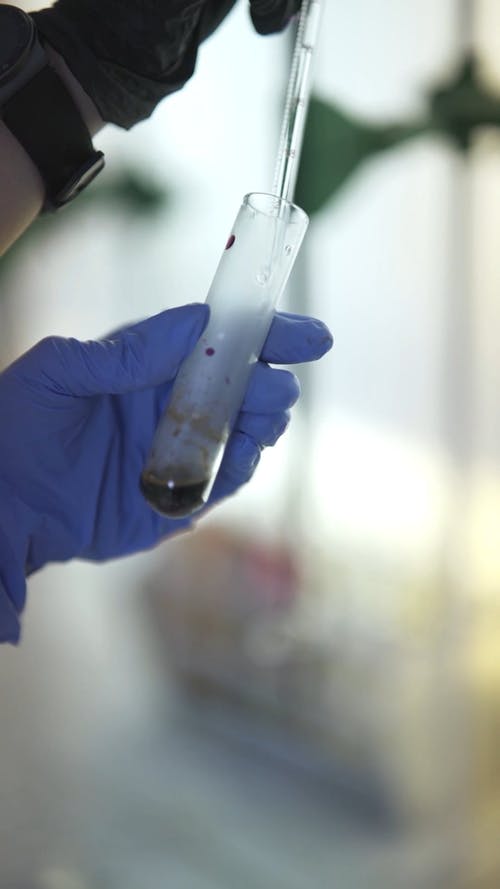 有关乳胶手套, 吸管, 垂直视频的免费素材视频